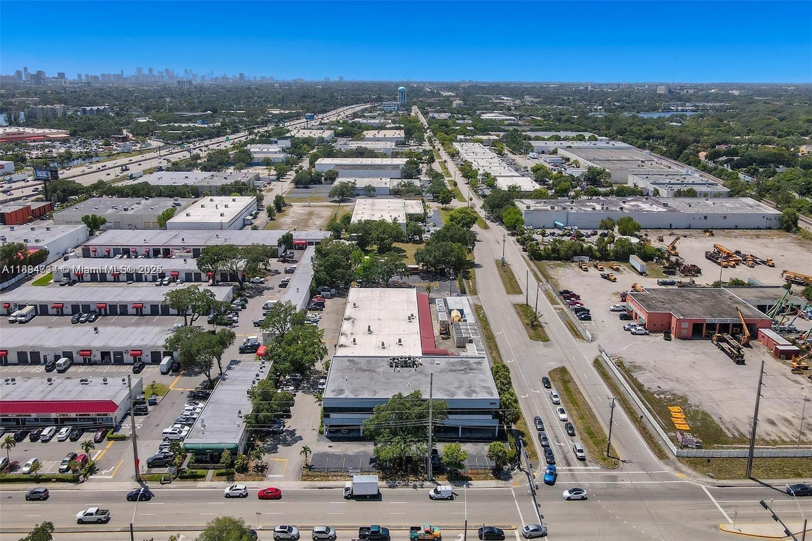 An aerial view shows a commercial industrial park with multiple warehouses, parking lots, and roads — 2870 Stirling Rd, Hollywood FL 33020, HOLLYWOOD, FL