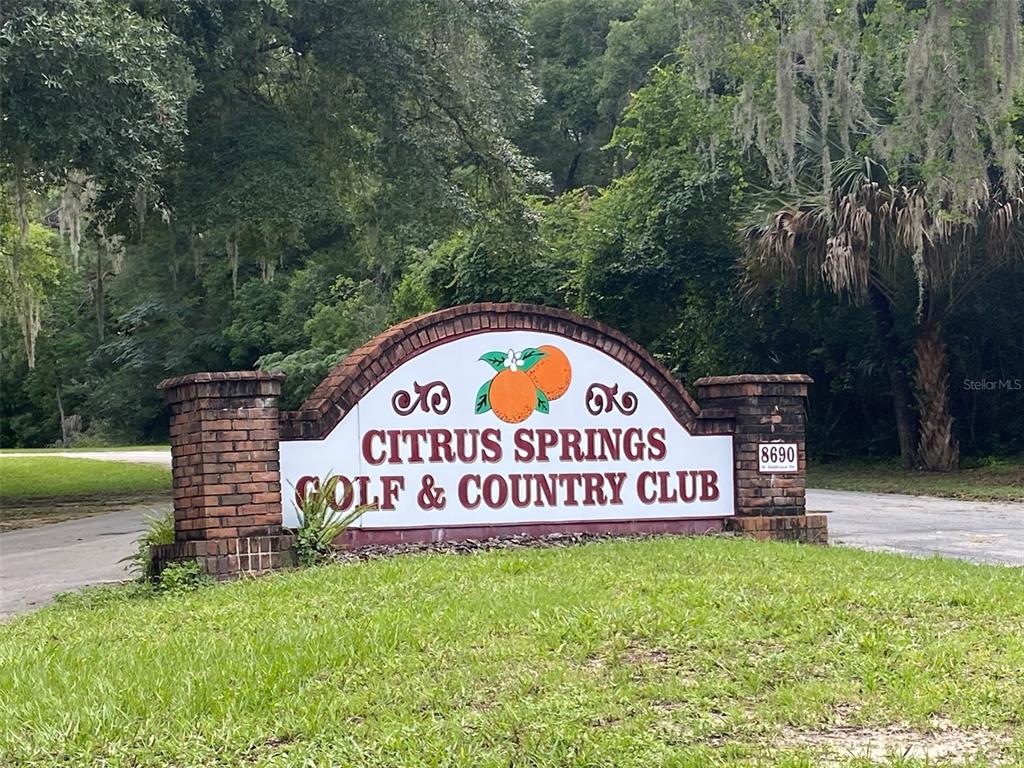 A brick monument sign for the Citrus Springs Golf & Country Club stands outdoors — 8739 N UPLAND DRIVE, CITRUS SPRINGS, FL