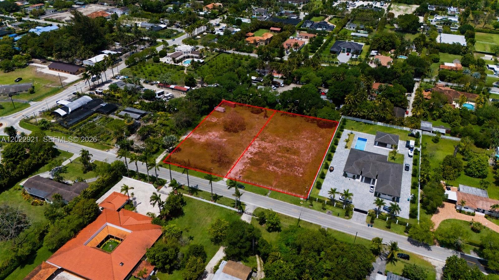 An aerial view shows two adjacent vacant lots outlined in red next to a house — 12085-12095 SW 47th St, Miami FL 33175, MIAMI, FL