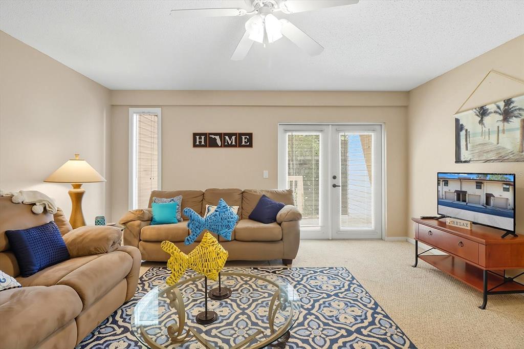 A living room features beige furniture, a patterned area rug, and a ceiling fan — 5152 S SWIFTWATER WAY, HOMOSASSA, FL