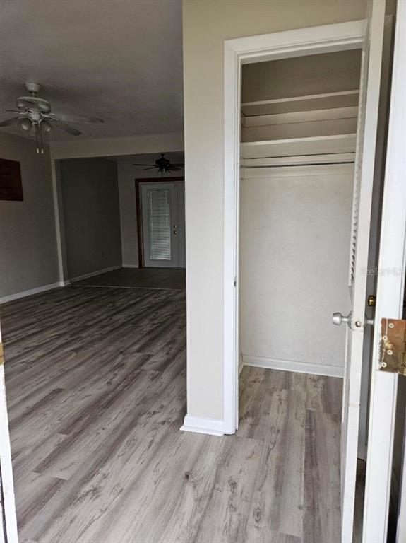 A view from a doorway looking into a living area with light wood-look flooring — 1528 N POWERS DRIVE, ORLANDO, FL