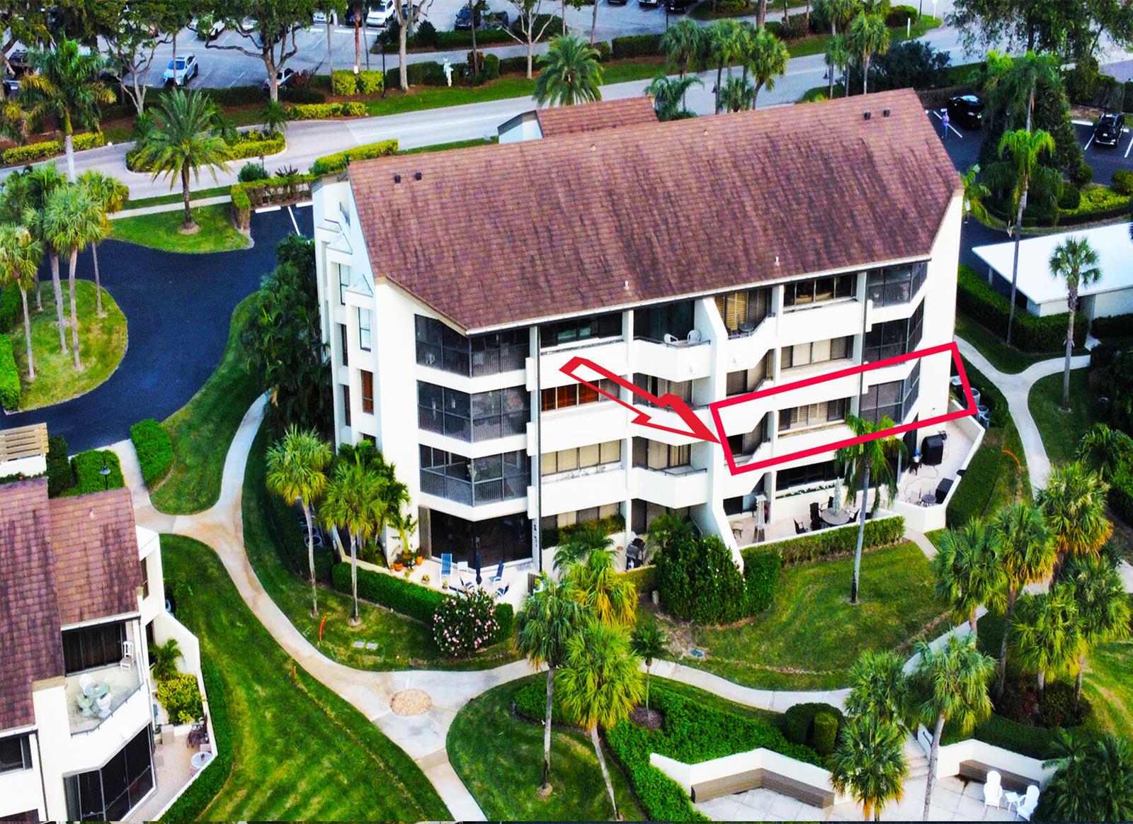 An aerial view of a multi-story apartment building with a red outline highlighting a balcony — 1117 Marine Way E, North Palm Beach FL 33408, NORTH PALM BEACH, FL