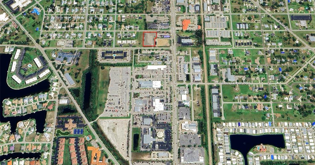 This aerial map shows a vacant rectangular lot outlined in red within a suburban area — 120 W HENRY STREET, PUNTA GORDA, FL