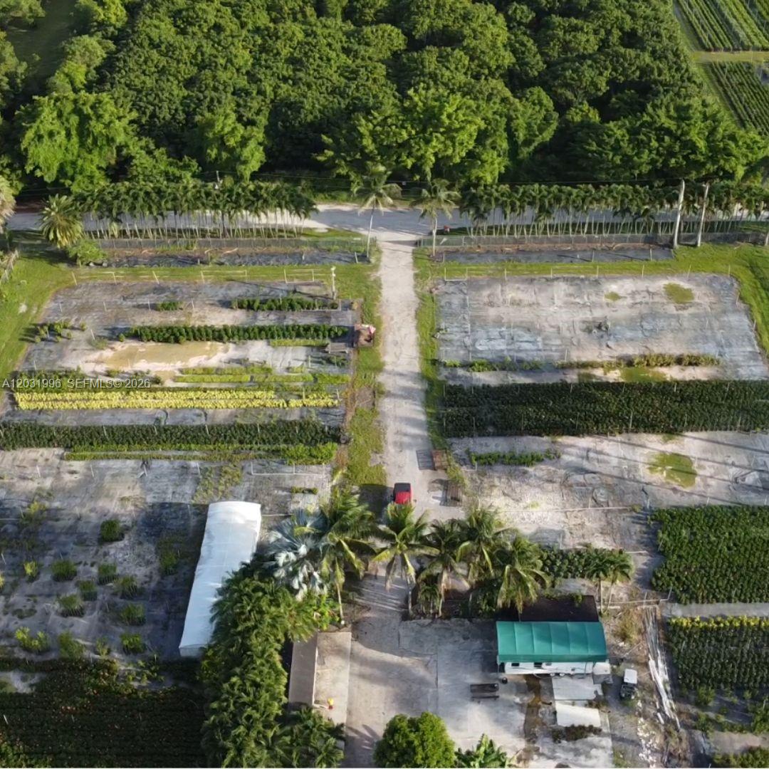 An aerial view shows a plant nursery with rows of crops, palm trees, and structures — 17001 SW 204th St, Miami FL 33187, MIAMI, FL