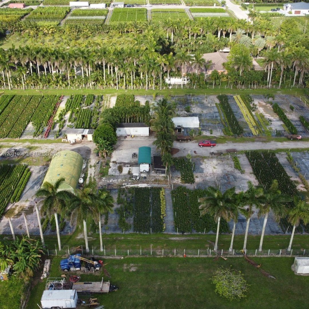 An aerial view shows a plant nursery with rows of crops, greenhouses, and several buildings — 17001 SW 204th St, Miami FL 33187, MIAMI, FL