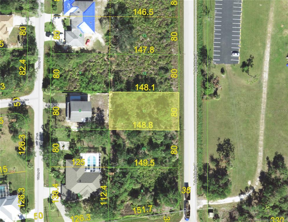This is an aerial map showing a highlighted rectangular plot of land among other lots — 3507 LOVELAND BOULEVARD, PUNTA GORDA, FL