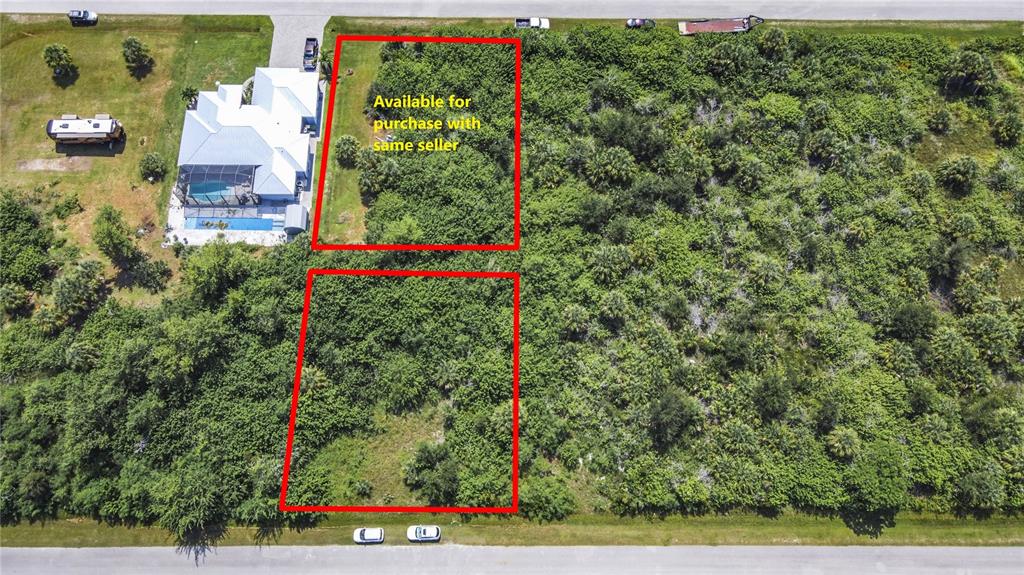 An aerial view shows two rectangular plots of land outlined in red near a house — 15419 MARGO CIRCLE, PORT CHARLOTTE, FL