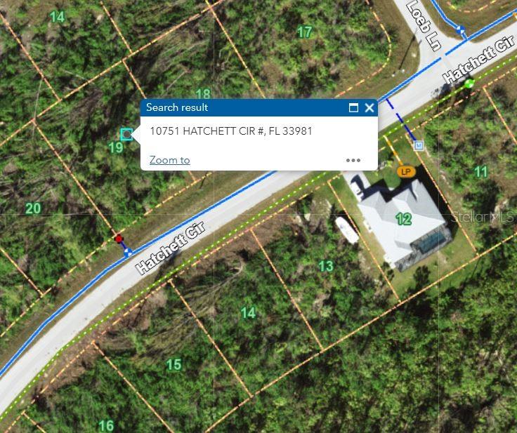 This is a satellite map view showing a vacant lot and surrounding residential properties — 10751 HATCHETT CIRCLE, PORT CHARLOTTE, FL
