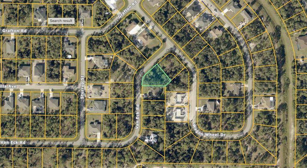 This is an aerial map showing a vacant, wooded residential lot highlighted in light green — VAN ECK ROAD, NORTH PORT, FL