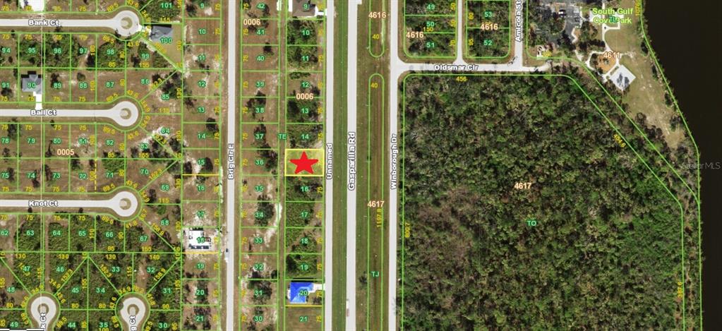 A paved road stretches into the distance with a car parked on the shoulder — 10217 GASPARILLA ROAD, PLACIDA, FL
