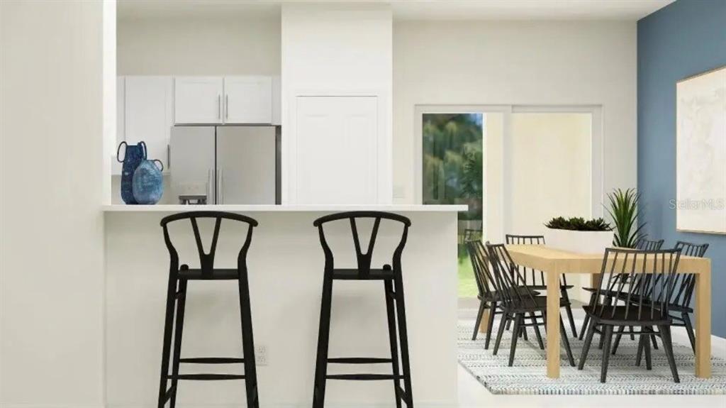 This is a digital rendering of a kitchen with a breakfast bar and dining area — 208 27TH STREET SE, RUSKIN, FL