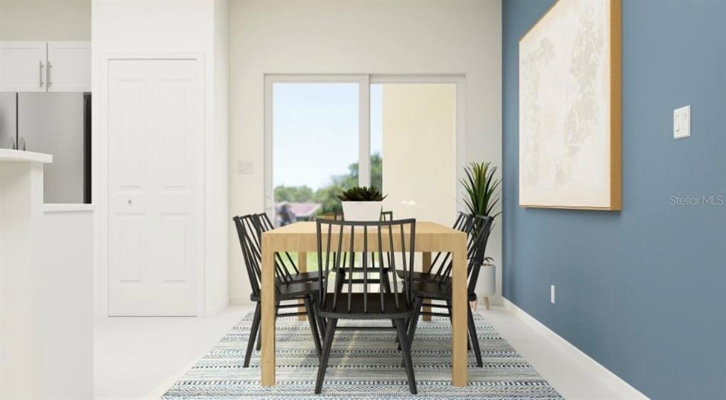 This is a rendering of a dining area with a wooden table, black chairs, and blue wall — 208 27TH STREET SE, RUSKIN, FL