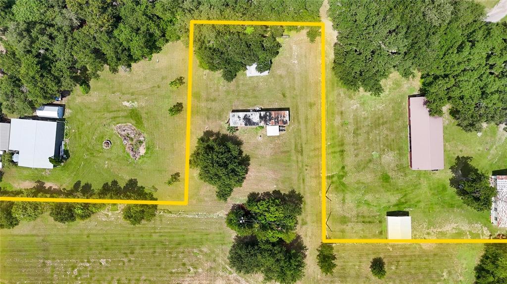An aerial view shows a rectangular lot with a mobile home and several outbuildings — 2452 WELCOME ROAD, LITHIA, FL