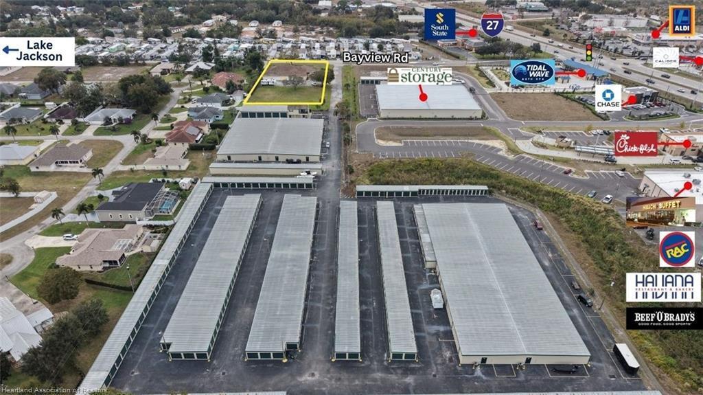 This aerial view shows a storage facility complex with a highlighted vacant lot nearby — 2605 Bayview Street # 2605, Sebring FL 33870, SEBRING, FL