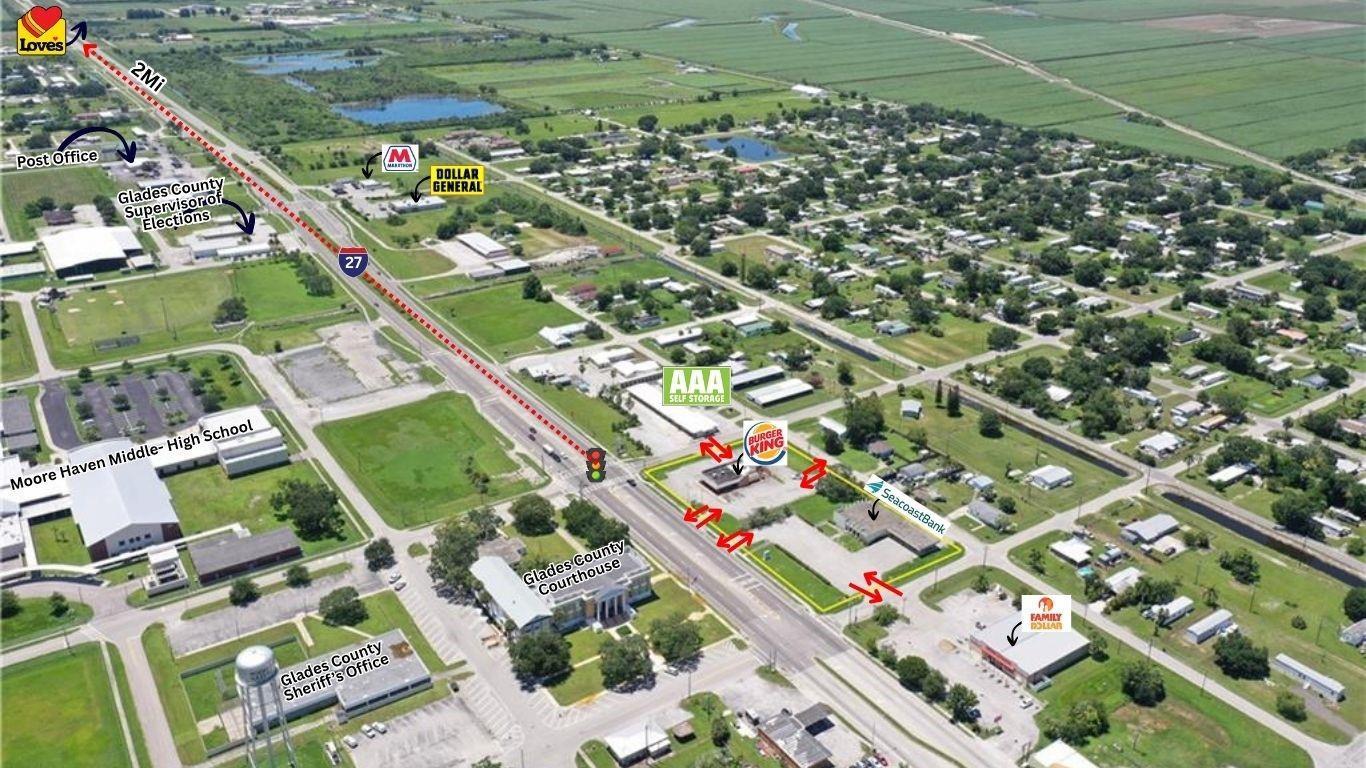 This aerial map shows a commercial area in Moore Haven, Florida, with various labeled landmarks — 599 US 27, Moore Haven FL 33471, MOORE HAVEN, FL