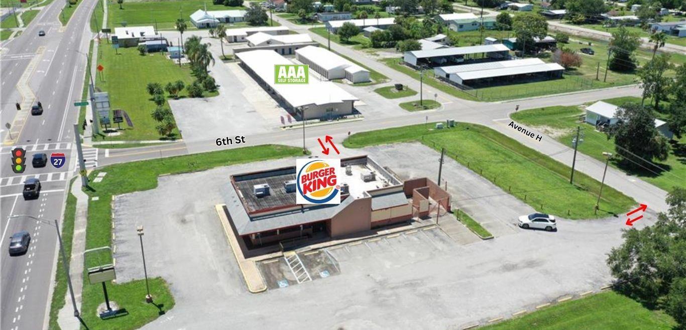 An aerial view shows a Burger King restaurant building with a parking lot and surrounding streets — 599 US 27, Moore Haven FL 33471, MOORE HAVEN, FL