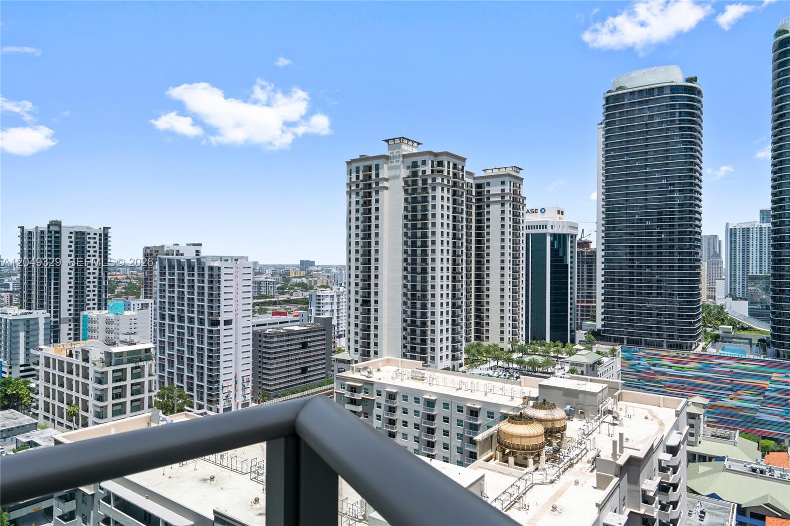 An elevated view of a city skyline featuring multiple high-rise apartment buildings and skyscrapers — 1100 S Miami Ave # 2306, Miami FL 33130, MIAMI, FL