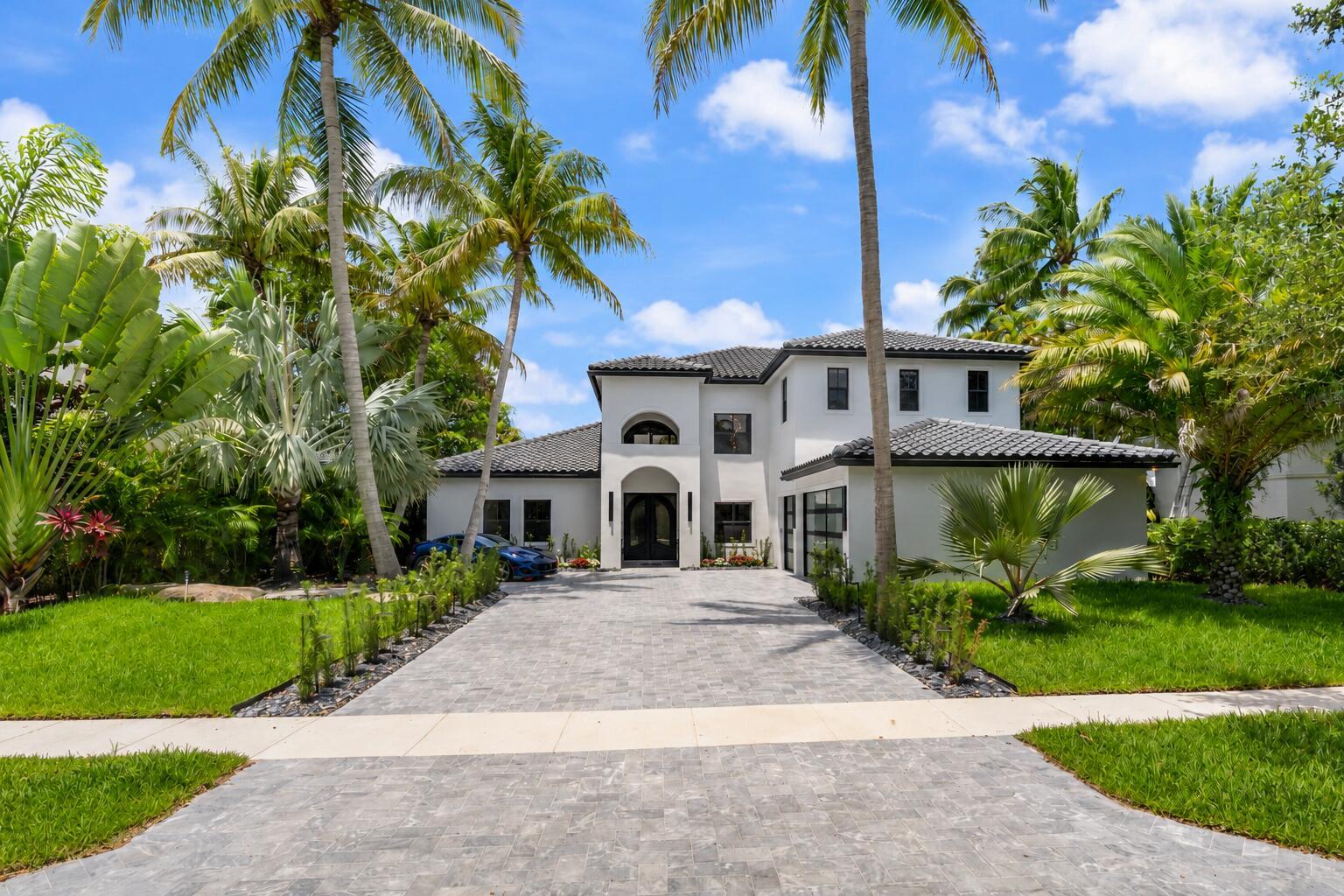 A two-story white house with a dark tile roof and a paved driveway — 17585 Middlebrook Way, Boca Raton FL 33496, BOCA RATON, FL