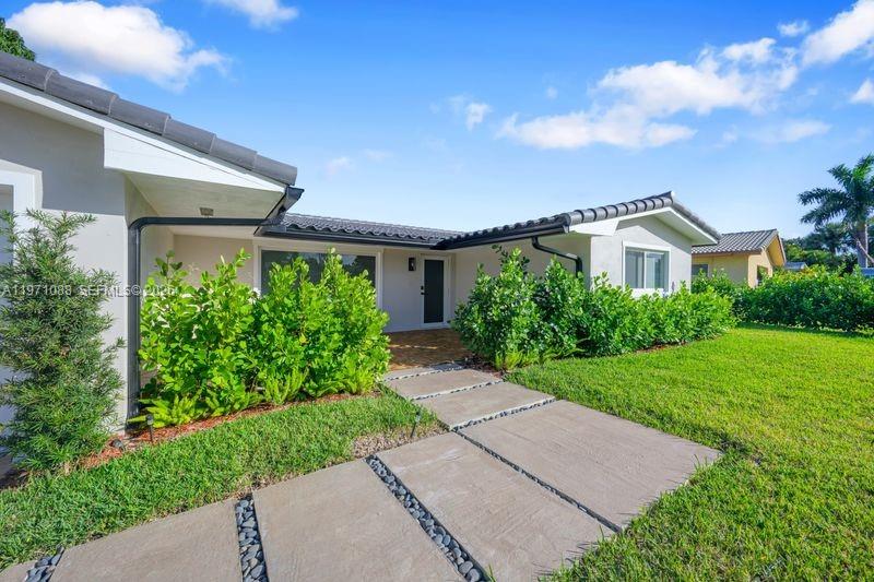 A modern single-story house features a concrete paver walkway leading to the front entrance — 1810 SW 6th Ave, Pompano Beach FL 33060, POMPANO BEACH, FL