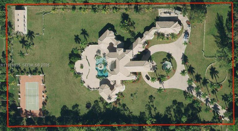 An aerial view shows a large house with a pool, tennis court, and circular driveway — 21579 Cartagena Dr, Boca Raton FL 33428, BOCA RATON, FL