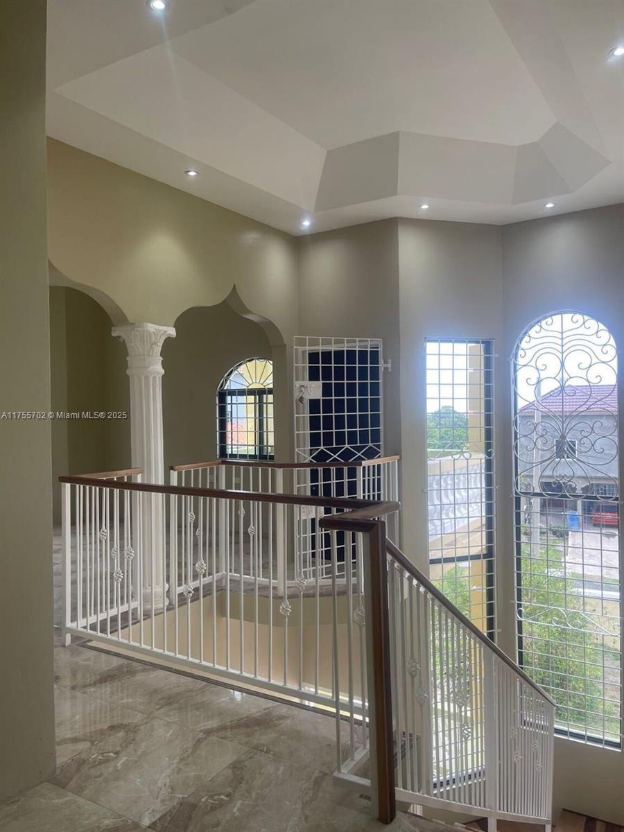 An indoor staircase with a white metal railing leads to a landing with marble flooring — 00 Discovery Pointe, Discovery Bay, St Ann, Jamaica, NA, NA