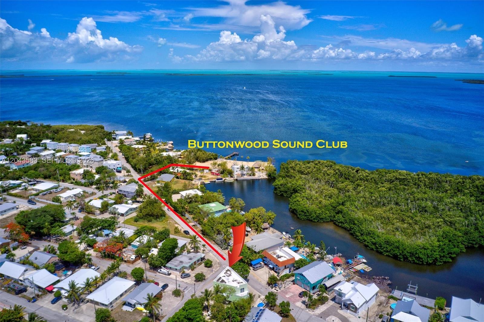 An aerial view shows a coastal neighborhood with a red outline highlighting a property — 19 Park Drive, Key Largo FL 33037, KEY LARGO, FL