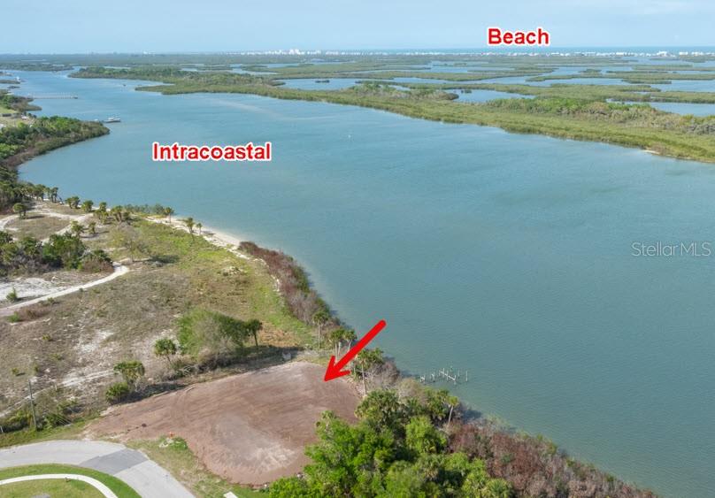 An aerial view shows a cleared waterfront lot along the Intracoastal Waterway — 183 & 185 JONES FISH CAMP ROAD, EDGEWATER, FL