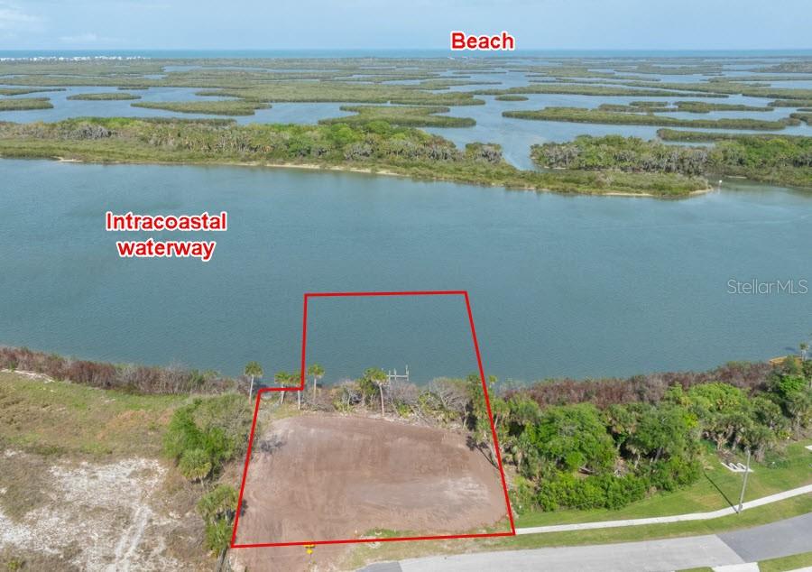 An aerial view shows a cleared waterfront lot bordering the Intracoastal Waterway — 183 & 185 JONES FISH CAMP ROAD, EDGEWATER, FL