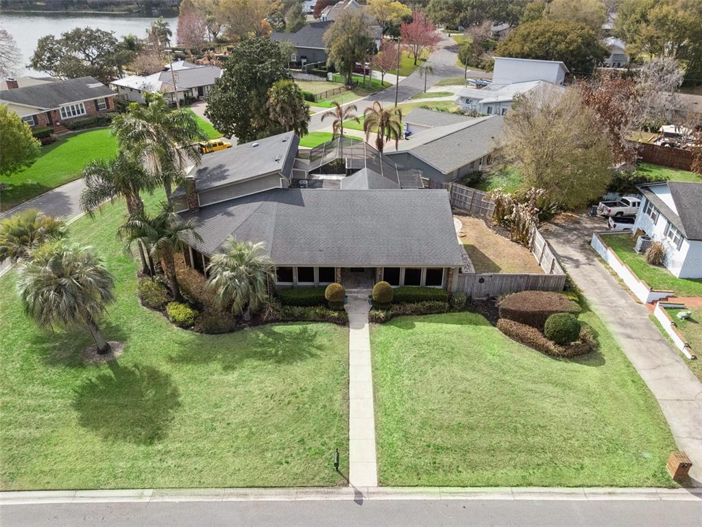 An aerial view shows a single-story house with a gray roof and a front lawn — 3226 S OSCEOLA AVENUE, ORLANDO, FL