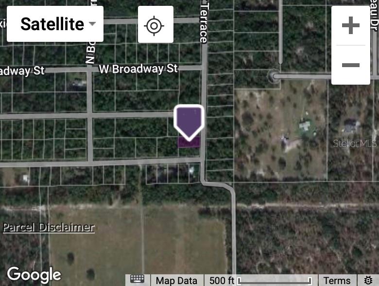 This is a satellite map view showing a highlighted parcel of land — 10048 N HOLYOAK TERRACE, DUNNELLON, FL