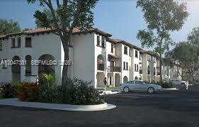This is a digital rendering of a multi-story apartment building with a parking lot — 15540 SW 136th St # 220, Miami FL 33196, MIAMI, FL
