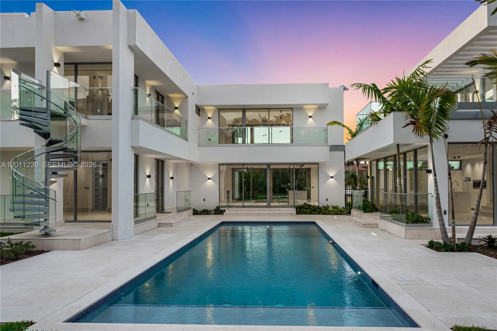 A modern two-story white house features a rectangular swimming pool and a spiral staircase — 3280 Lake Ridge Lane, Weston FL 33332, WESTON, FL