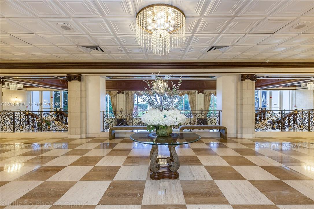A grand lobby features a checkered marble floor, a crystal chandelier, and a central table — 2030 S Ocean Dr # 1826, Hallandale Beach FL 33009, HALLANDALE BEACH, FL