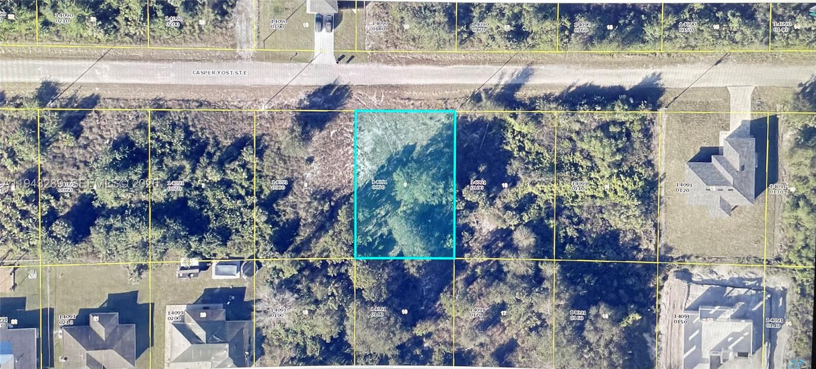 This is an aerial map showing a highlighted vacant lot in a residential area — 850 CASPER YOST ST E, Lehigh Acres FL 33974, LEHIGH ACRES, FL