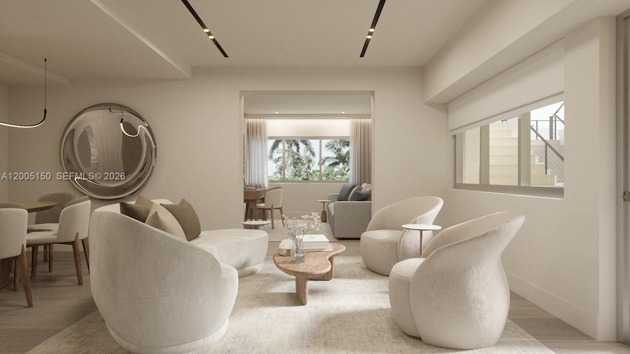 This rendering shows a modern living room with cream-colored furniture and a circular wall mirror — 250 Collins Ave # 107, Miami Beach FL 33139, MIAMI BEACH, FL