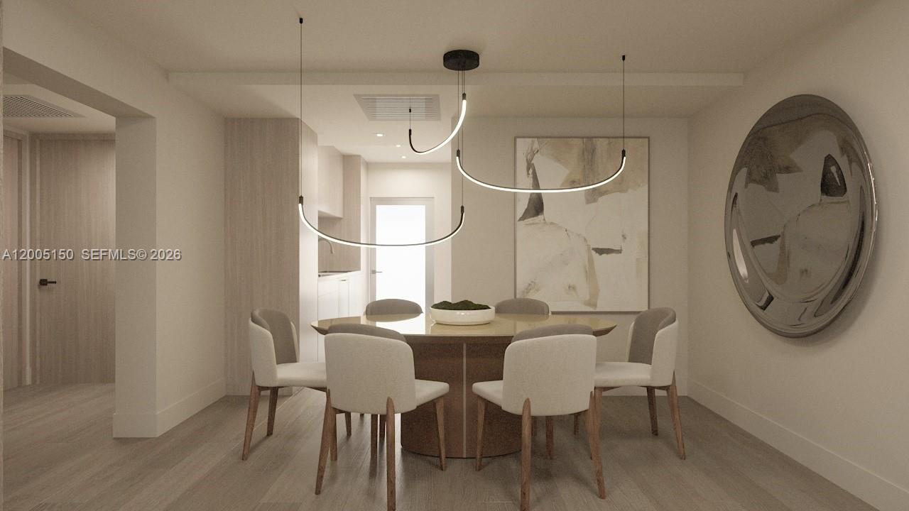 This is a rendering of a dining room featuring a round table and modern pendant lighting — 250 Collins Ave # 107, Miami Beach FL 33139, MIAMI BEACH, FL