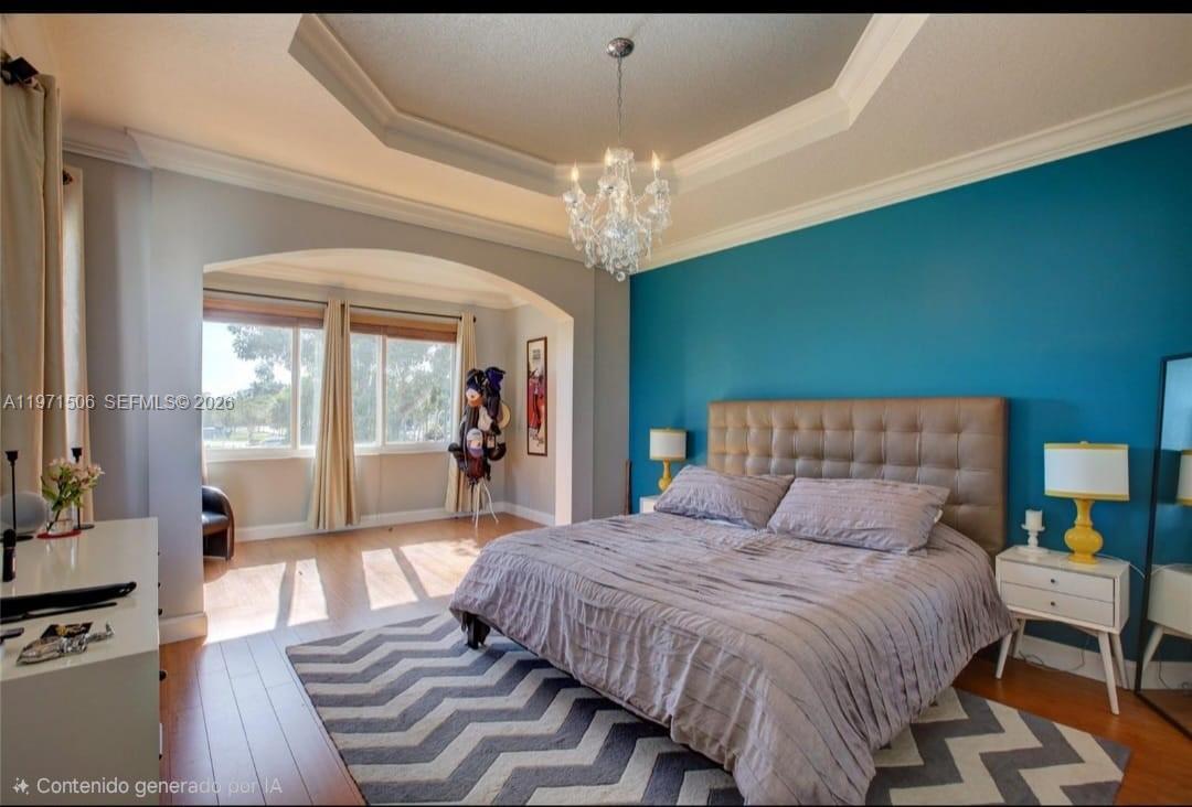 A bedroom features a tufted headboard, a teal accent wall, and a crystal chandelier — 2789 SW 130th Ter, Miramar FL 33027, MIRAMAR, FL