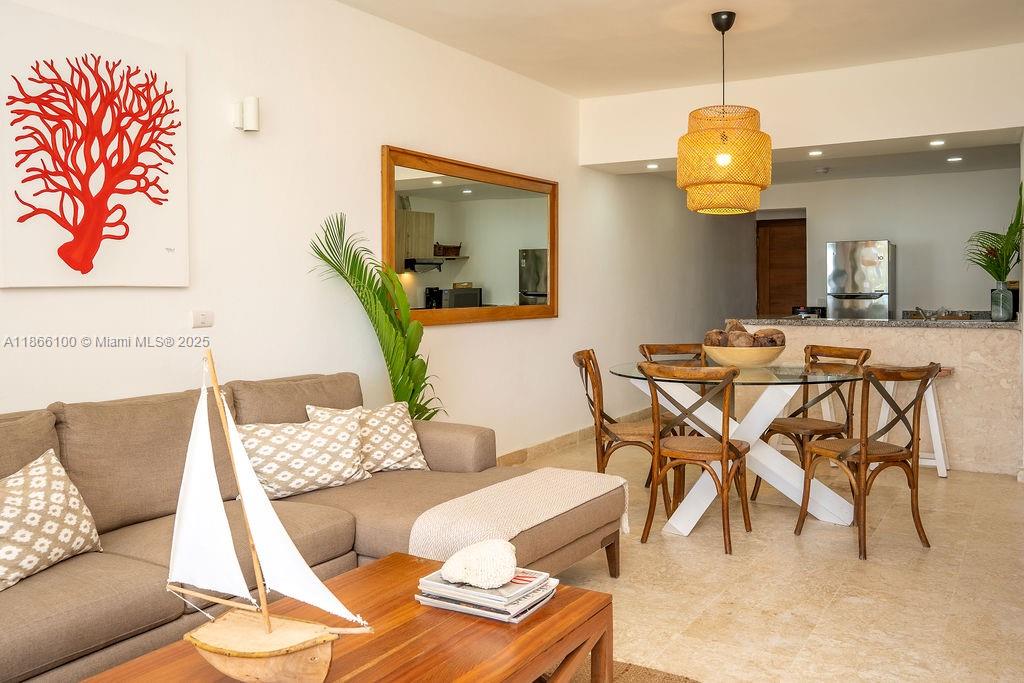 A living and dining area features a beige sofa, wooden coffee table, and glass-topped table — 000 8C3F+Q62, Las Terrenas 32000, Dominican Republic # 2, DR, DR