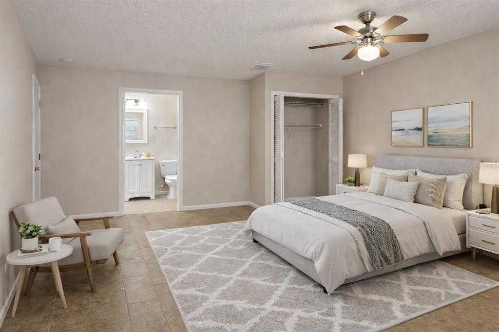 A dining area with a wooden table and chairs sits adjacent to an open kitchen — 416 BANANA CAY DRIVE UNIT D, SOUTH DAYTONA, FL