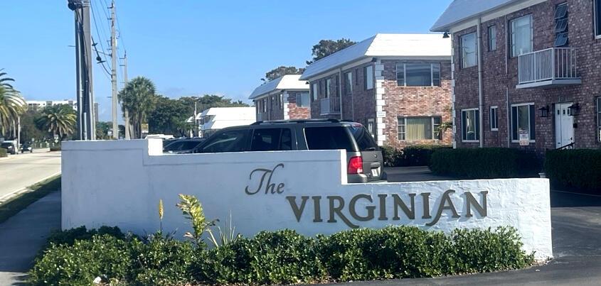 A white sign reading The Virginian stands in front of a brick apartment building — 412 S Cypress Road # 205, Pompano Beach FL 33060, POMPANO BEACH, FL