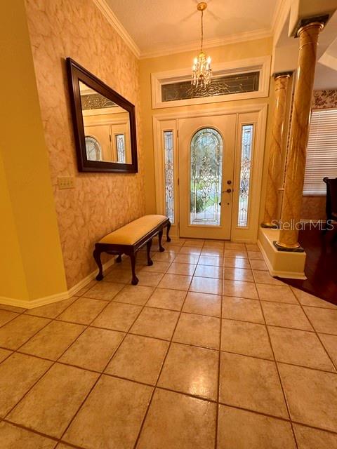 A dining room features floral wallpaper, a gold tray ceiling, and a wooden table set — 1826 WESTMINSTER COURT, LAKELAND, FL