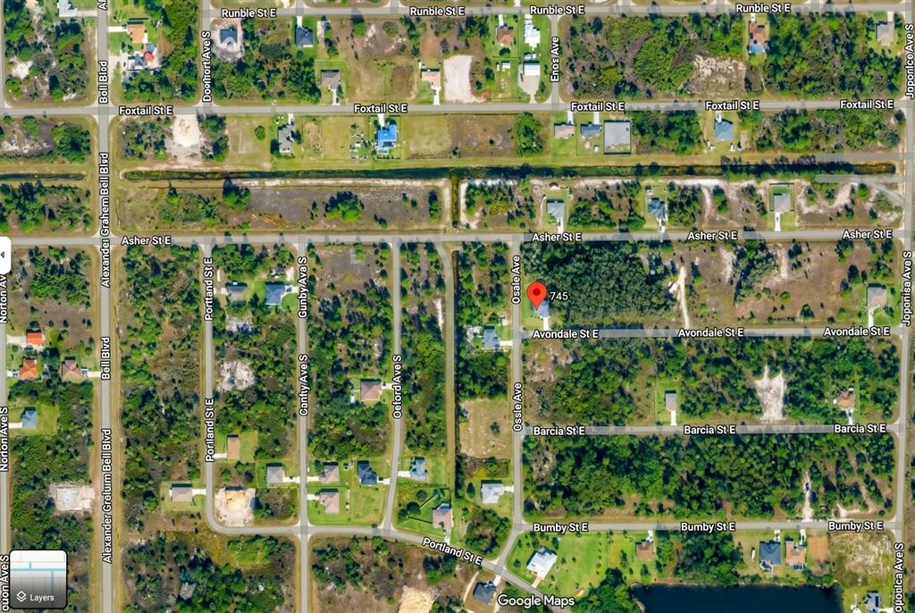 This is a satellite map view of a residential neighborhood with a red location pin — 745 AVONDALE STREET E, LEHIGH ACRES, FL