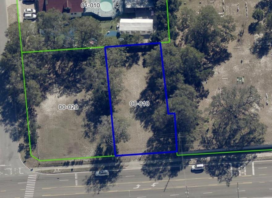 An aerial view shows two adjacent vacant lots outlined in blue and green along a road — 5910 OLD WINTER GARDEN ROAD, ORLANDO, FL