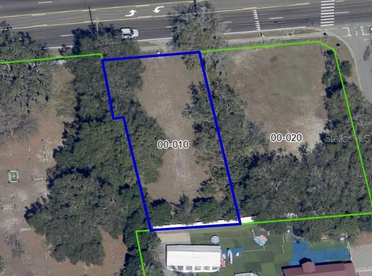 An aerial view shows two adjacent vacant lots outlined in blue and green — 5910 OLD WINTER GARDEN ROAD, ORLANDO, FL