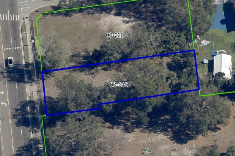 An aerial view shows two adjacent rectangular plots of land outlined in green and blue — 5910 OLD WINTER GARDEN ROAD, ORLANDO, FL