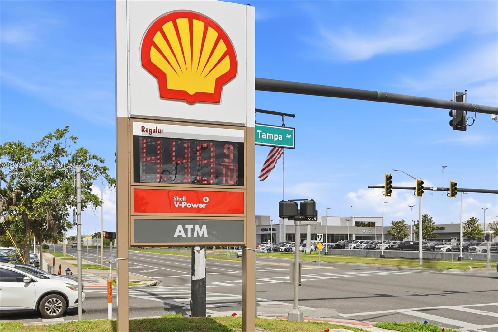 A Shell gas station sign stands at a street corner with a Tampa Avenue sign — 1916 W COLONIAL DR, Orlando FL 32804, ORLANDO, FL