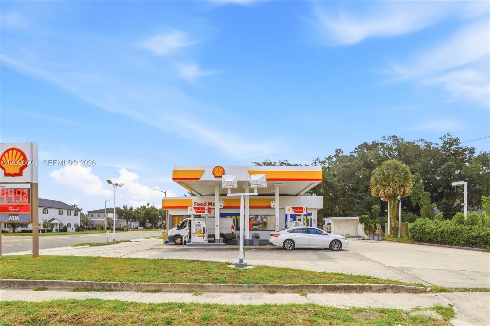 A Shell gas station with a convenience store and fuel pumps under a canopy — 1916 W COLONIAL DR, Orlando FL 32804, ORLANDO, FL