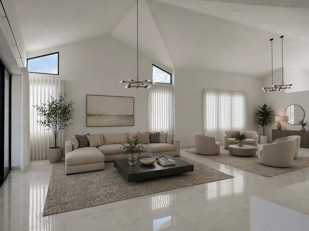 A spacious living room features vaulted ceilings, tile floors, neutral furniture, and two modern chandeliers — 927 SABANERA ISLA NORTE, DORADO, PR