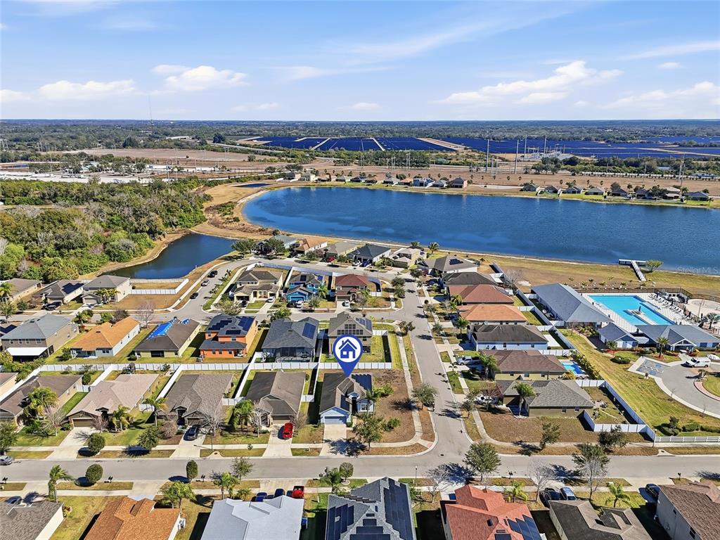 An aerial view shows a suburban neighborhood with a house marked by a blue icon — 2444 DAKOTA ROCK DRIVE, RUSKIN, FL
