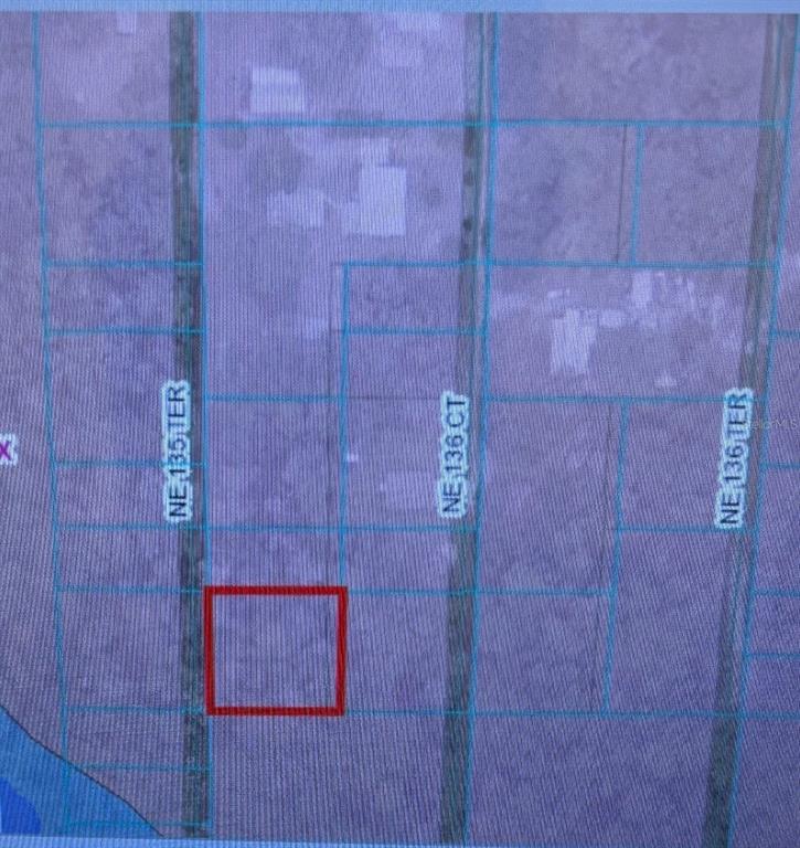 This is a map showing a highlighted rectangular plot of land between two roads — 0 NE 135TH TERRACE, FORT MC COY, FL